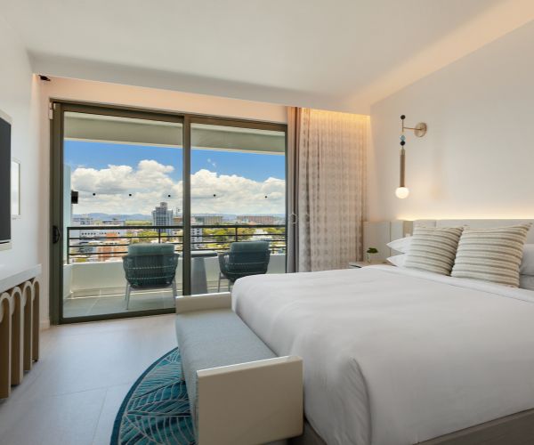 Guest room with a city view and a balcony