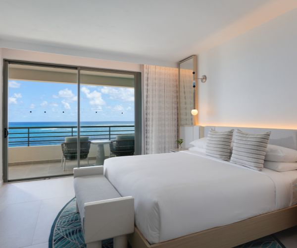 Bedroom with an ocean view and blackout curtains