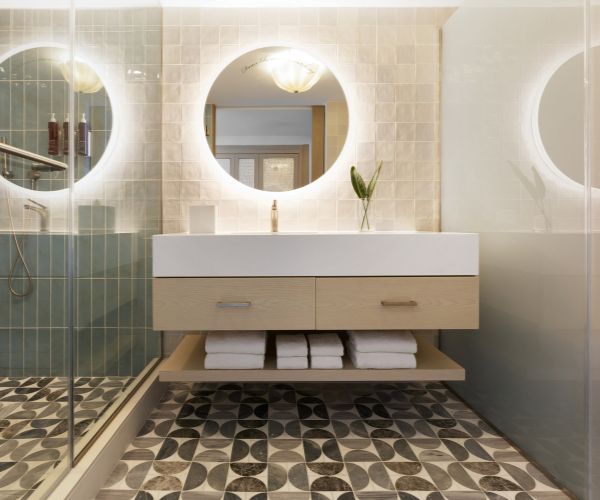 Bathroom with a combined shower and tub and a vanity