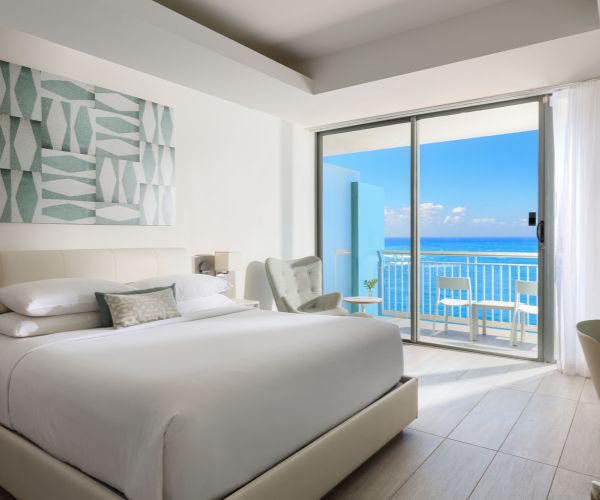Bedroom with an ocean view and blackout curtains