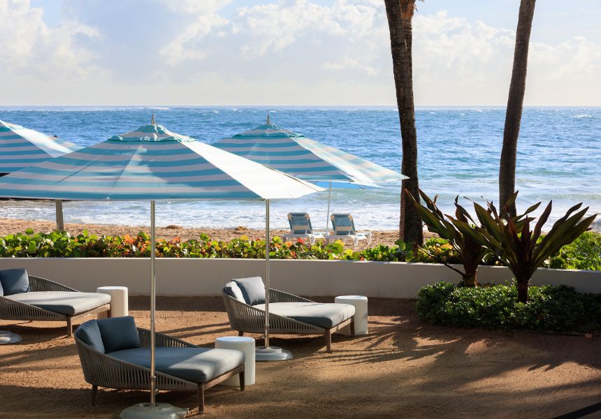 A group of people kayaking on the ocean during sunset