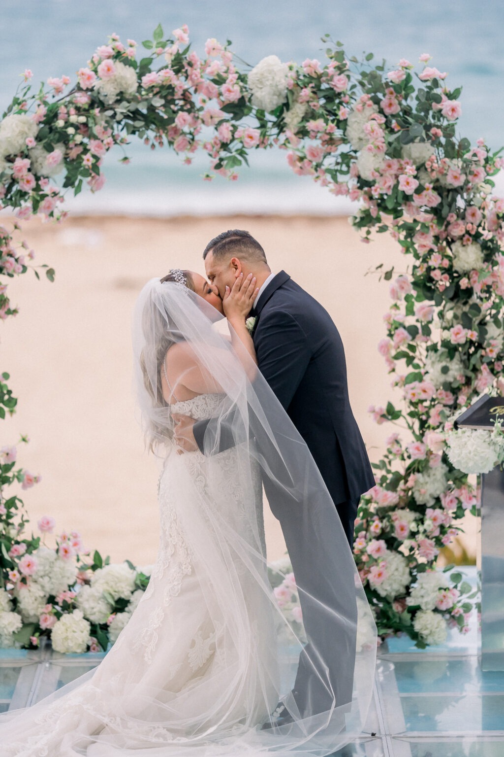The bride and groom kissing