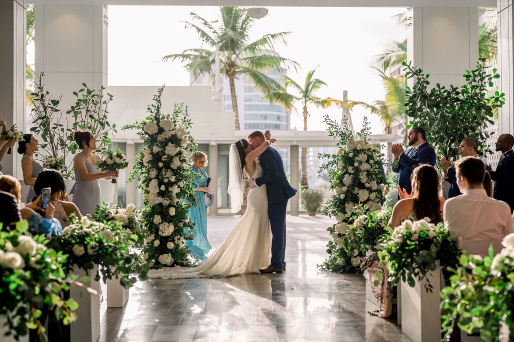 The bride and groom kissing