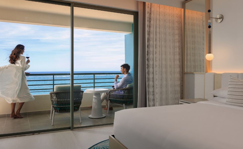 Woman overlooking La Concha Resort Pool and ocean view