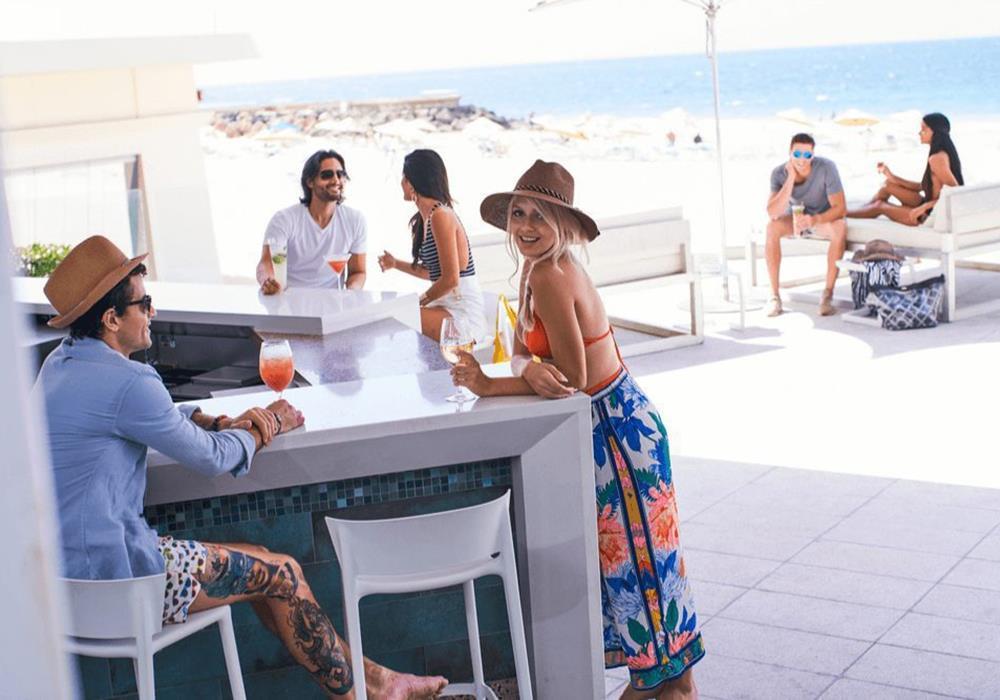 People hanging out at a bar