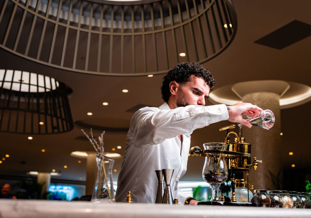 Bartender mixing at the bar