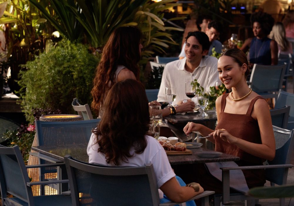 Friends eating at solera tables