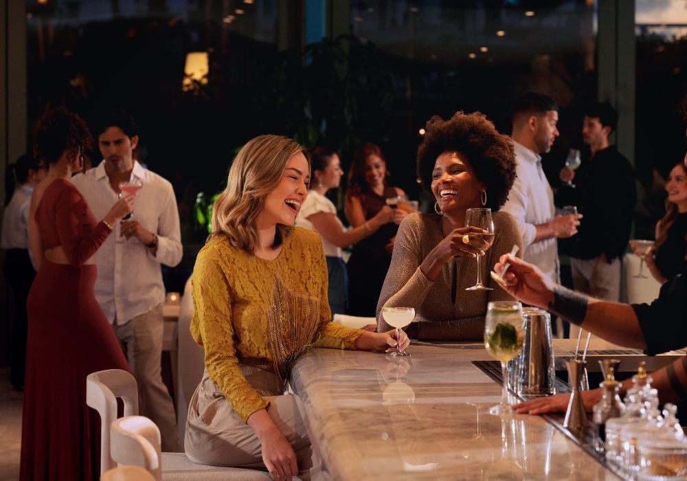 People drinking together at bar