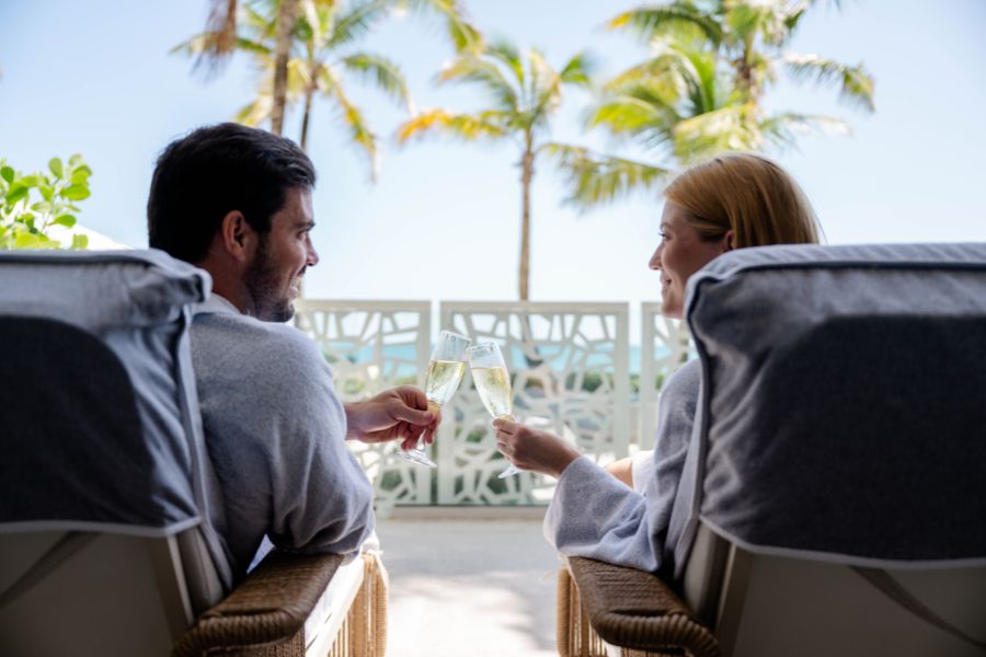 Couple lounging at elemara spa terrace