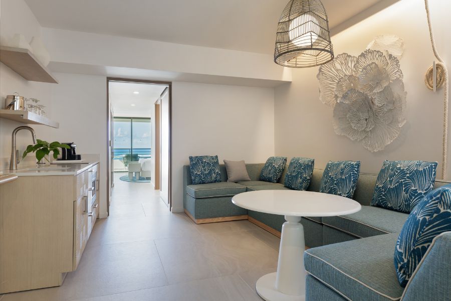 Living room with comfortable couch, kitchenette and view 