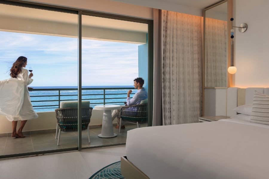 Couple at a Suite balcony with ocean view