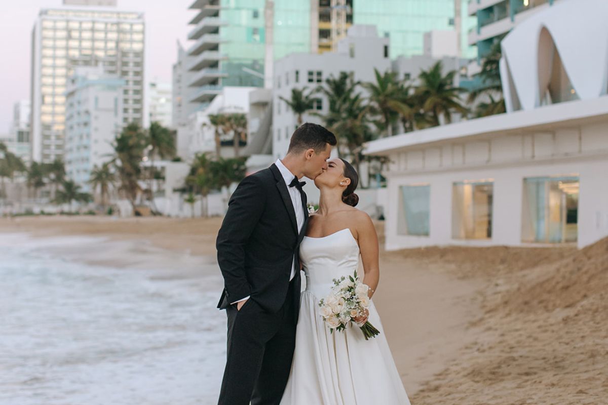 Wedding couple at the beach in front of the La Concha Shell