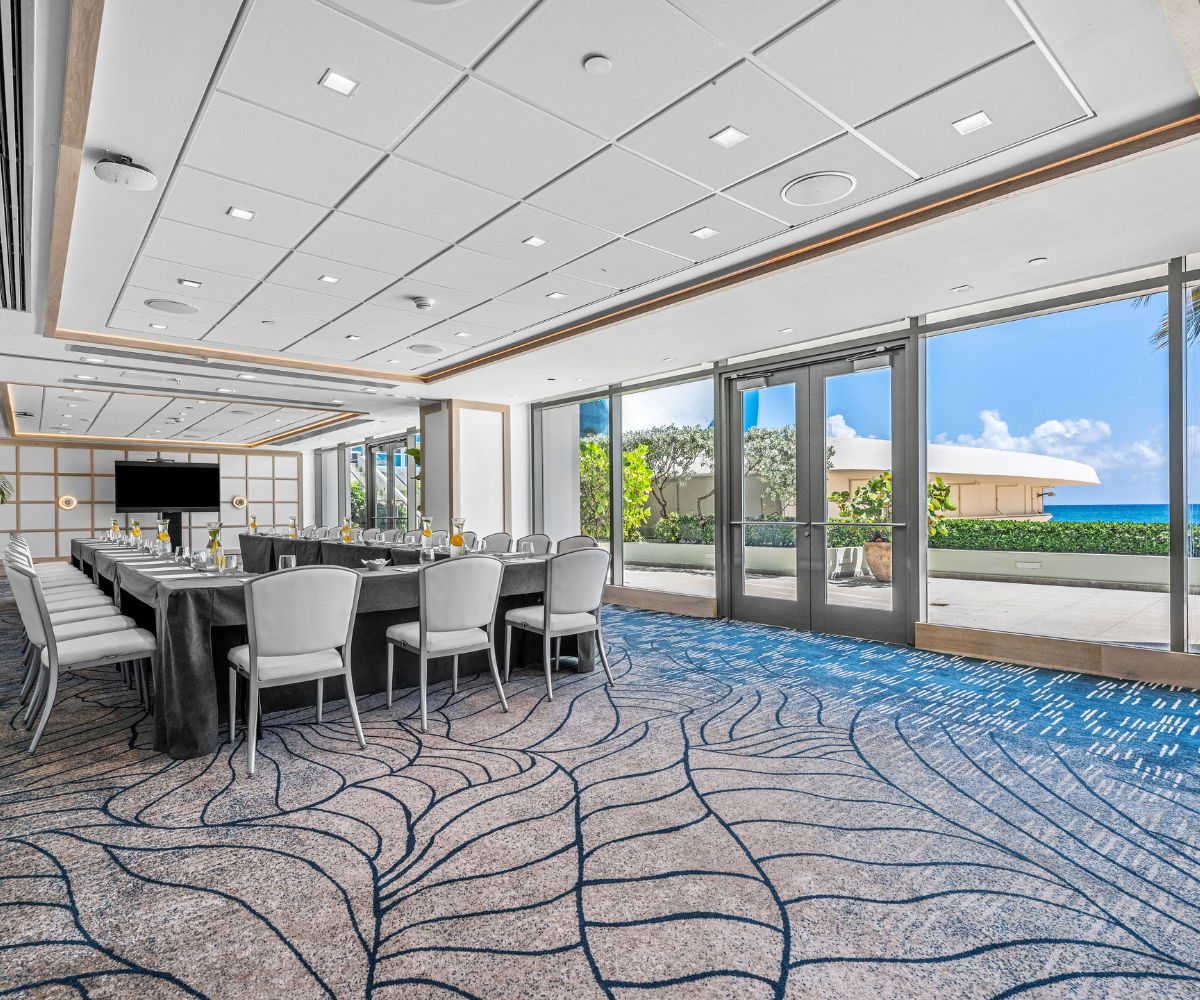 The same meeting room with chairs and tables and ocean view