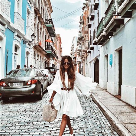 Someone on the street in a white dress