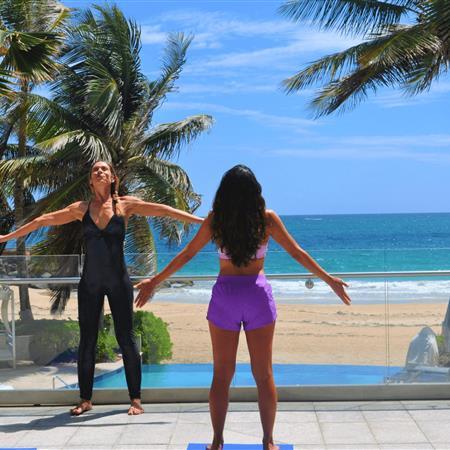Two people doing yoga