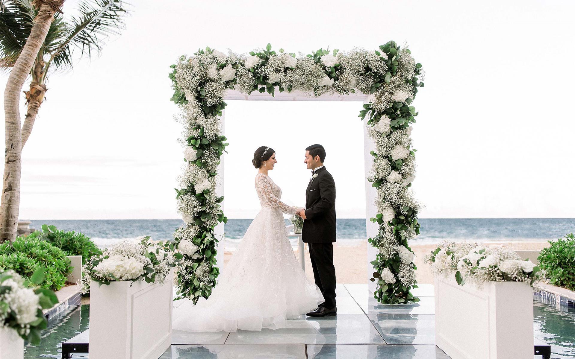 Wedding ceremony with rectangular flower arbor
