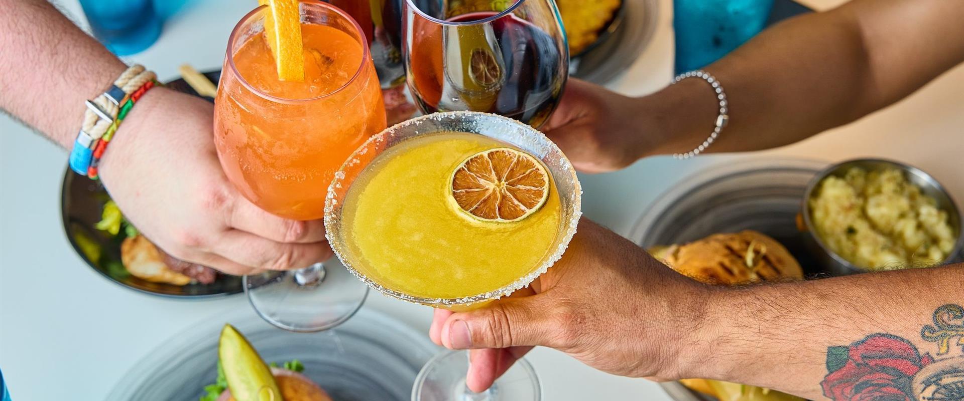 Three colorful alcoholic beverages