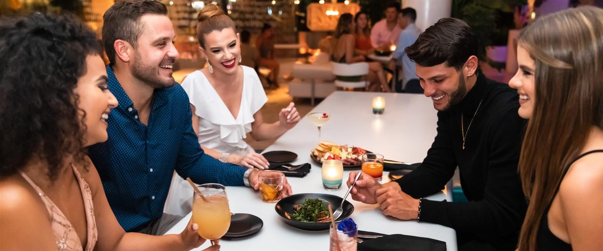 People eating and drinking together
