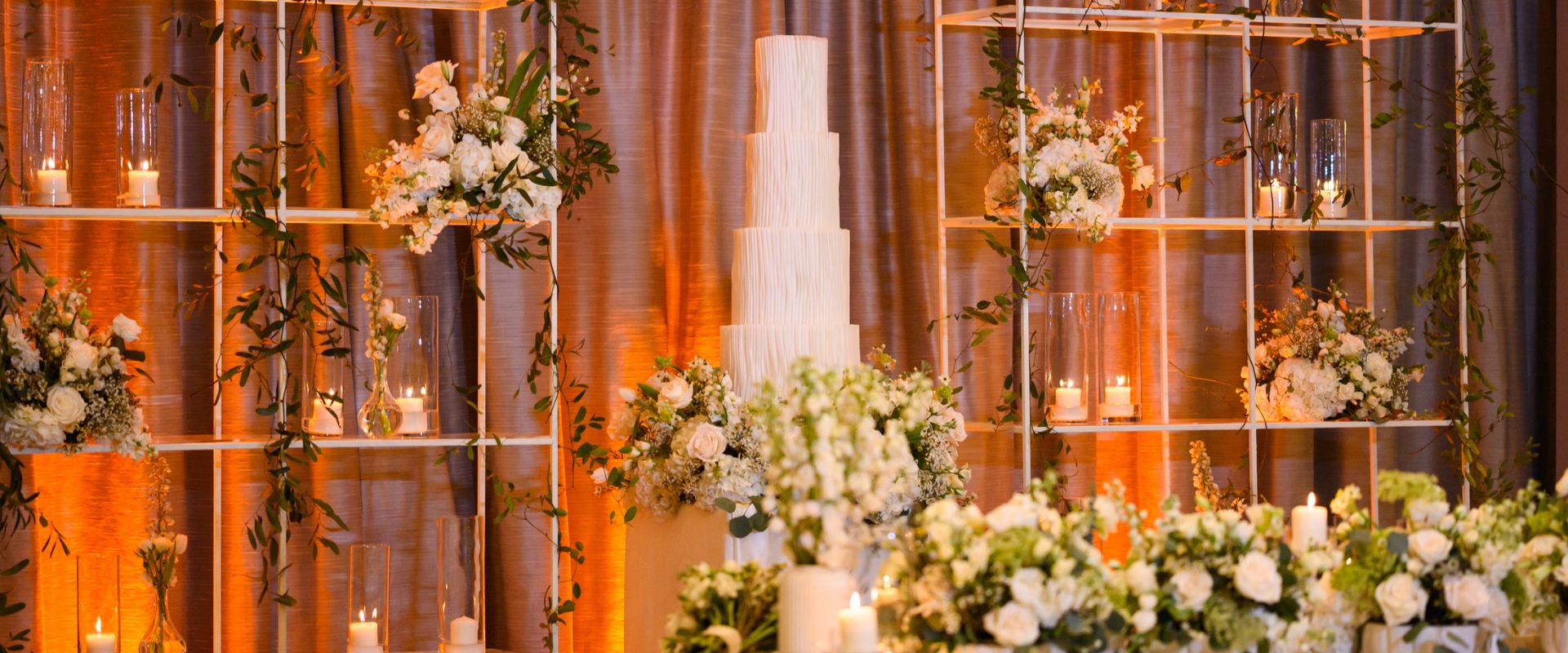 wedding decorations cake and wall with flowers