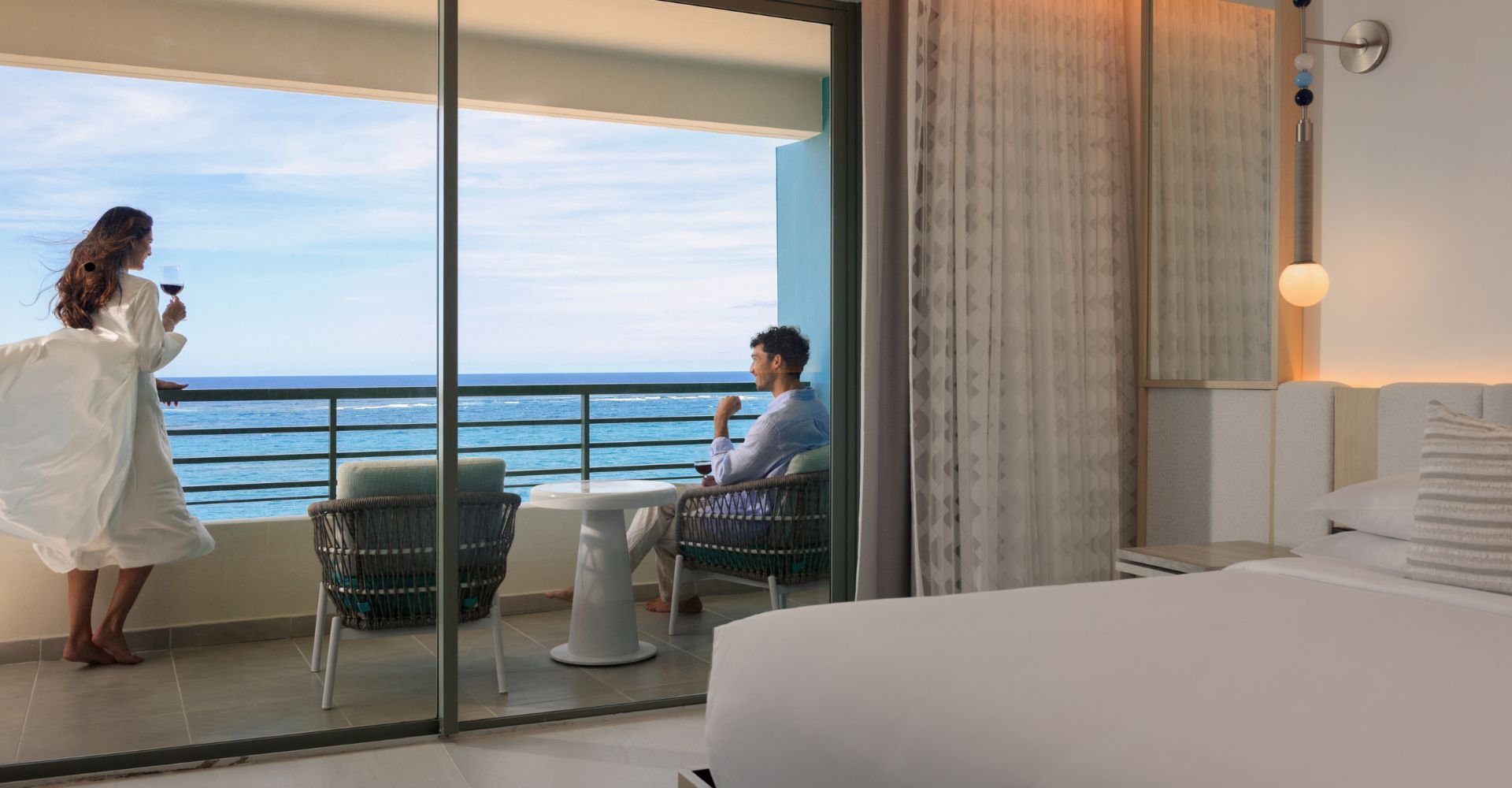 couple drinking wine at room balcony at la concha resort
