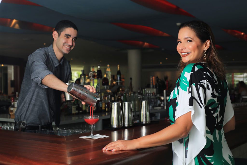 bartender serving cocktail at lobby bar