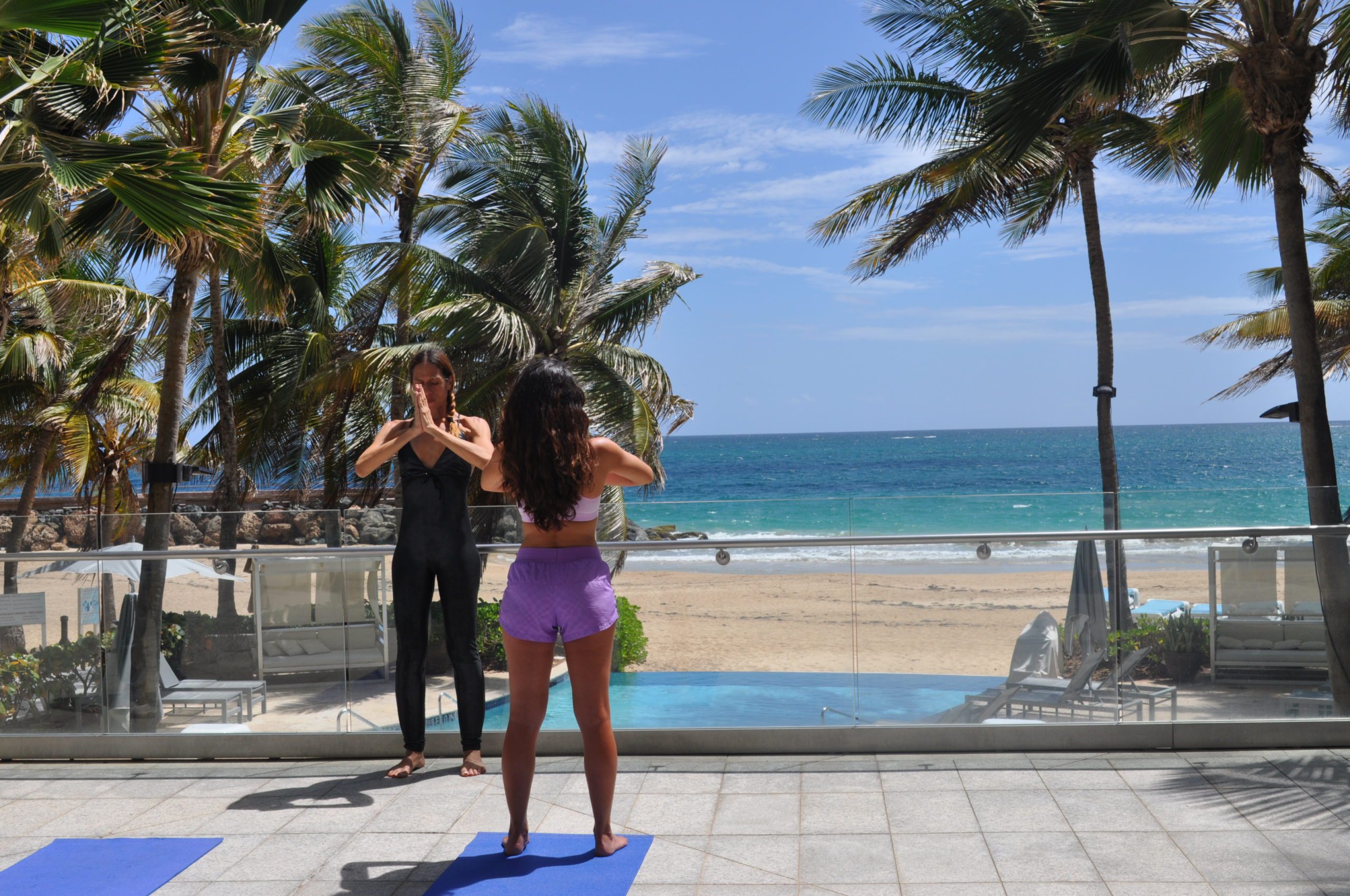 Two women at beachfront Wellness session at la concha resort san juan