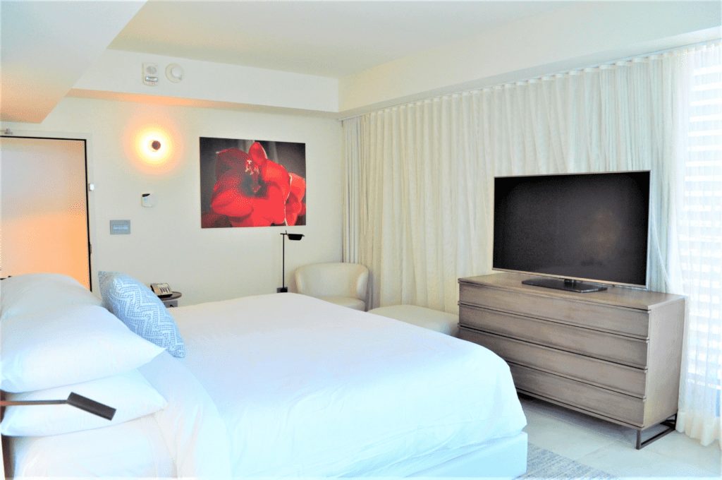 Executive corner suite king bedroom bed and tv unit at la concha san juan